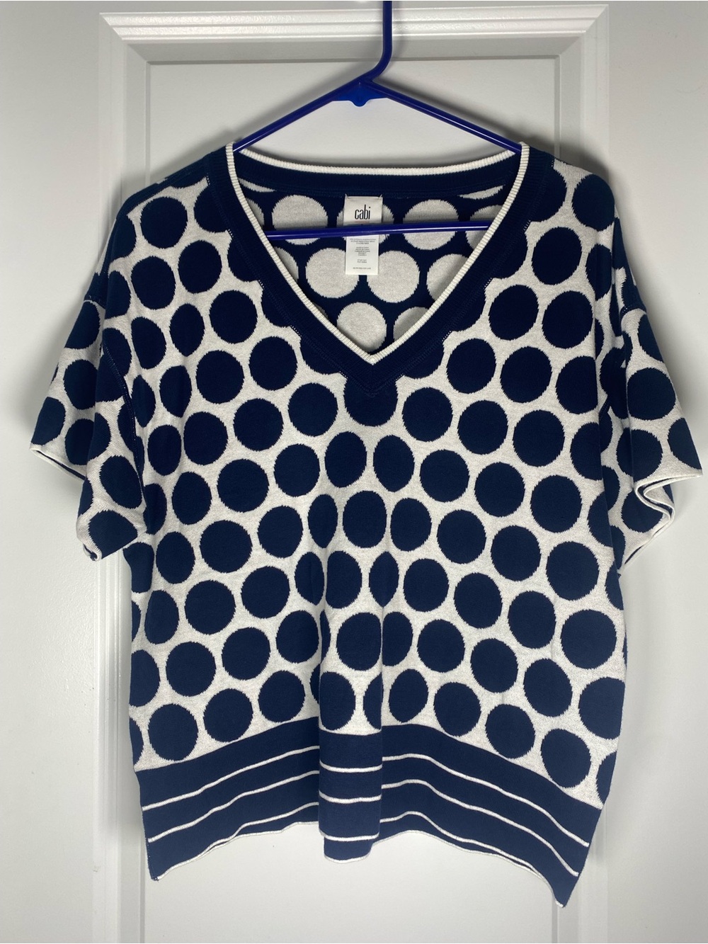 CAbi Navy and White Polka Dot V‑Neck Short Sleeve Top